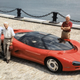 Promotional image of the 1986 Chevrolet Corvette Indy concept, with engineers Dave Hill, Zora Arkus-Duntov and Dave McLellan standing around the car.